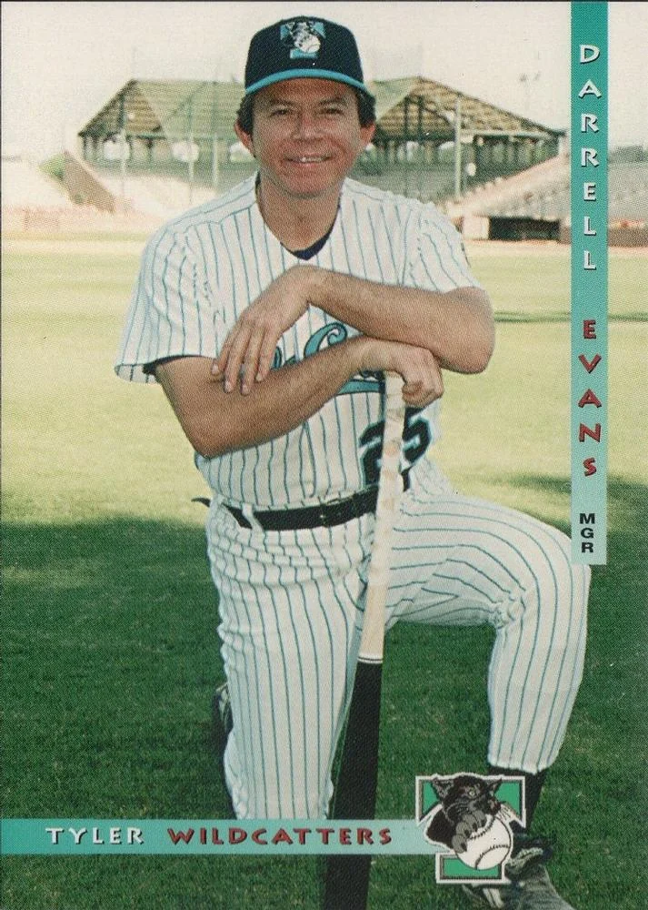 1997 Grandstand Tyler WildCatters card of manager Darrell Evans kneeling on a bat in a pinstriped uniform at Mike Carter Field