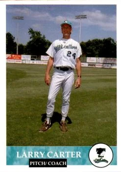 1994 Collect-A-Sport Tyler Wildcatters card of Larry Carter, pitcher and coach, standing in a pinstriped number 24 uniform and teal cap at Mike Carter Field